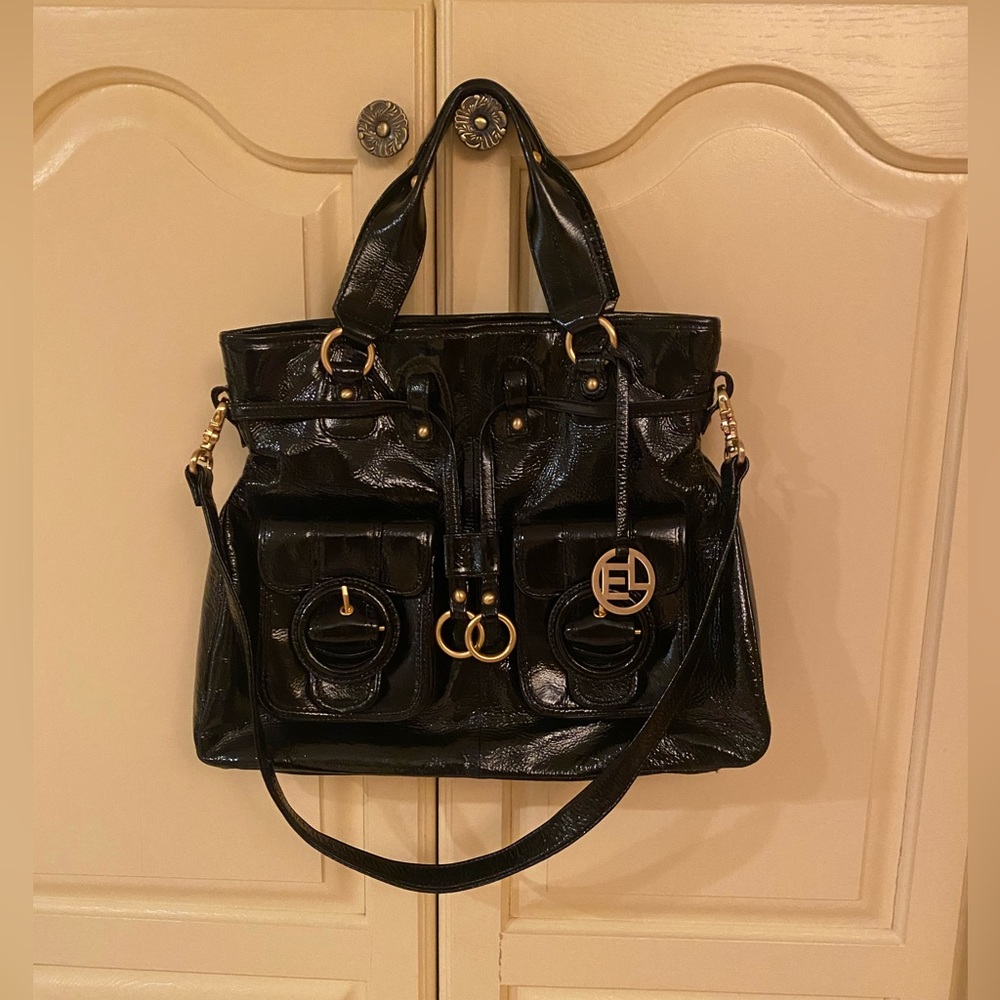 11 by 14. Elliot Luca Black patent leather gold hardware., excellent condition